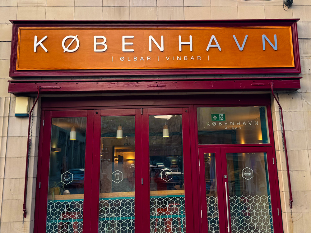 Shopfront signage for København bar with raised letters and modern window graphics, created by G4 Graphics Bradford