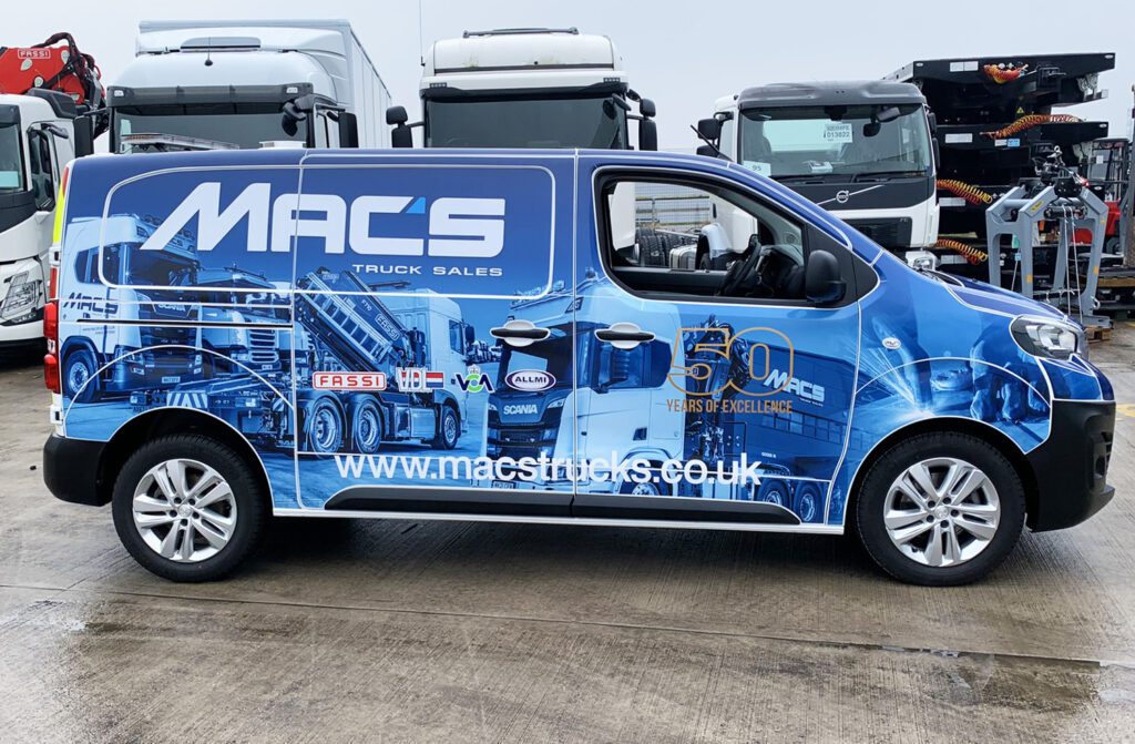 Full vehicle wrap for MACS Truck Sales featuring detailed truck graphics and company branding